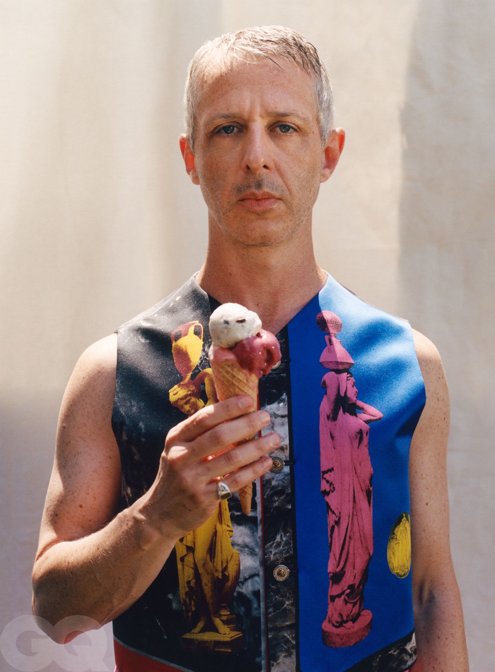 Image may contain Jeremy Strong Clothing Vest TShirt Photography Face Head Person Portrait Adult and Cream