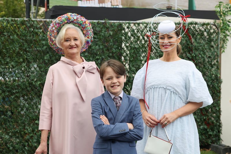 Alex Doolan (12) with the the hat he made from more than 5,500 individual pieces for his grandmother Brid Hanlon (left), who was competing with Alex's mother Laura Hanlon at the show. Photograph: Alan Betson