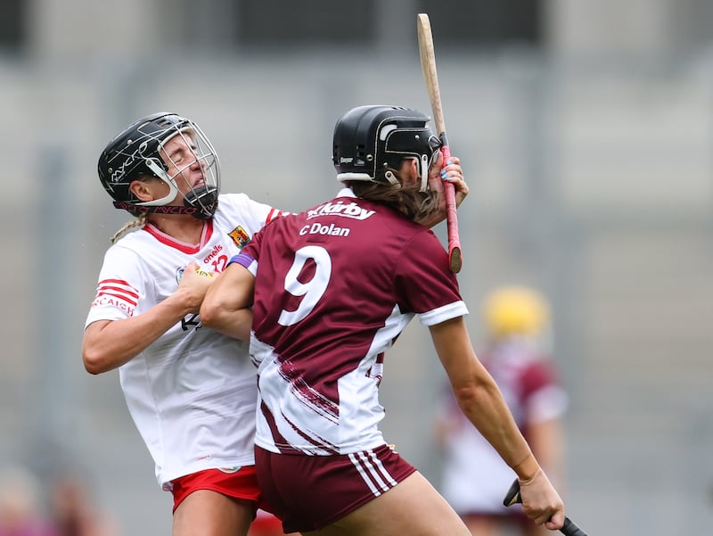 Galway's Carrie Dolan fouls Millie Condon of Cork. Photograph: Grace Halton/Inpho