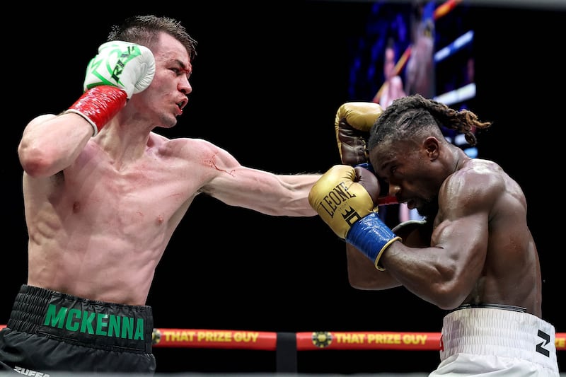 Aaron McKenna lands a punch on Etinosa Oliha. Photograph: Gary Carr/Inpho