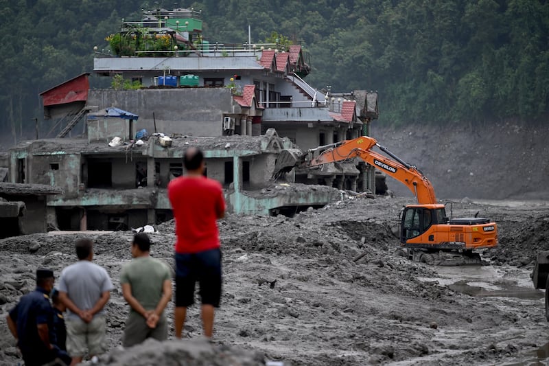 Rescue work continues in the aftermath of flash floods at Trishuli Centre in Nepal's Nuwakot district. Photograph: Arun Sankar/AFP via Getty Images