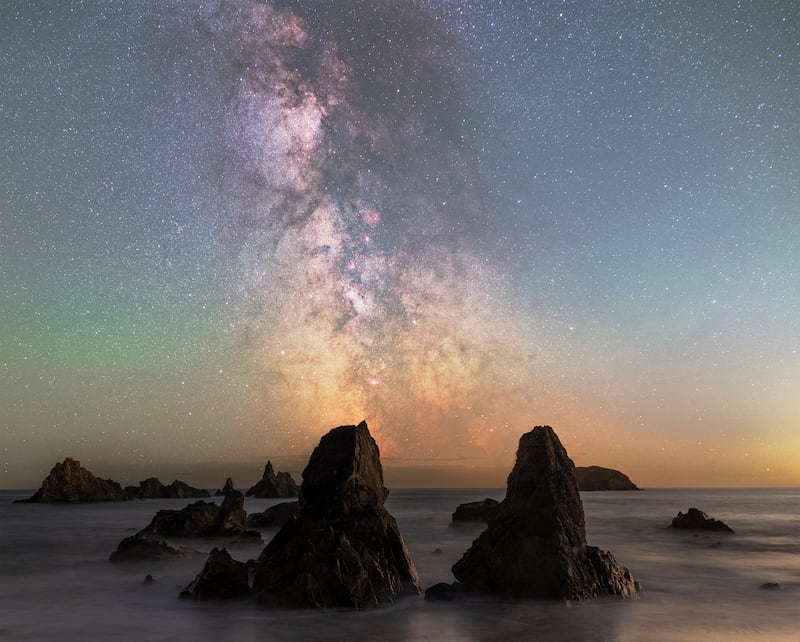 Runner-up in the Back on Earth category, Copper Coast Milky Way. The image was taken at Kilfarrisay Beach, Co Waterford, with the Milky Way visible in the night sky between two prominent rocks. Photograph: Tom O'Donoghue