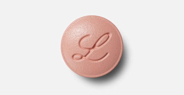A Foundayo pill with manufacturer Eli Lilly's logo stamped onto it
