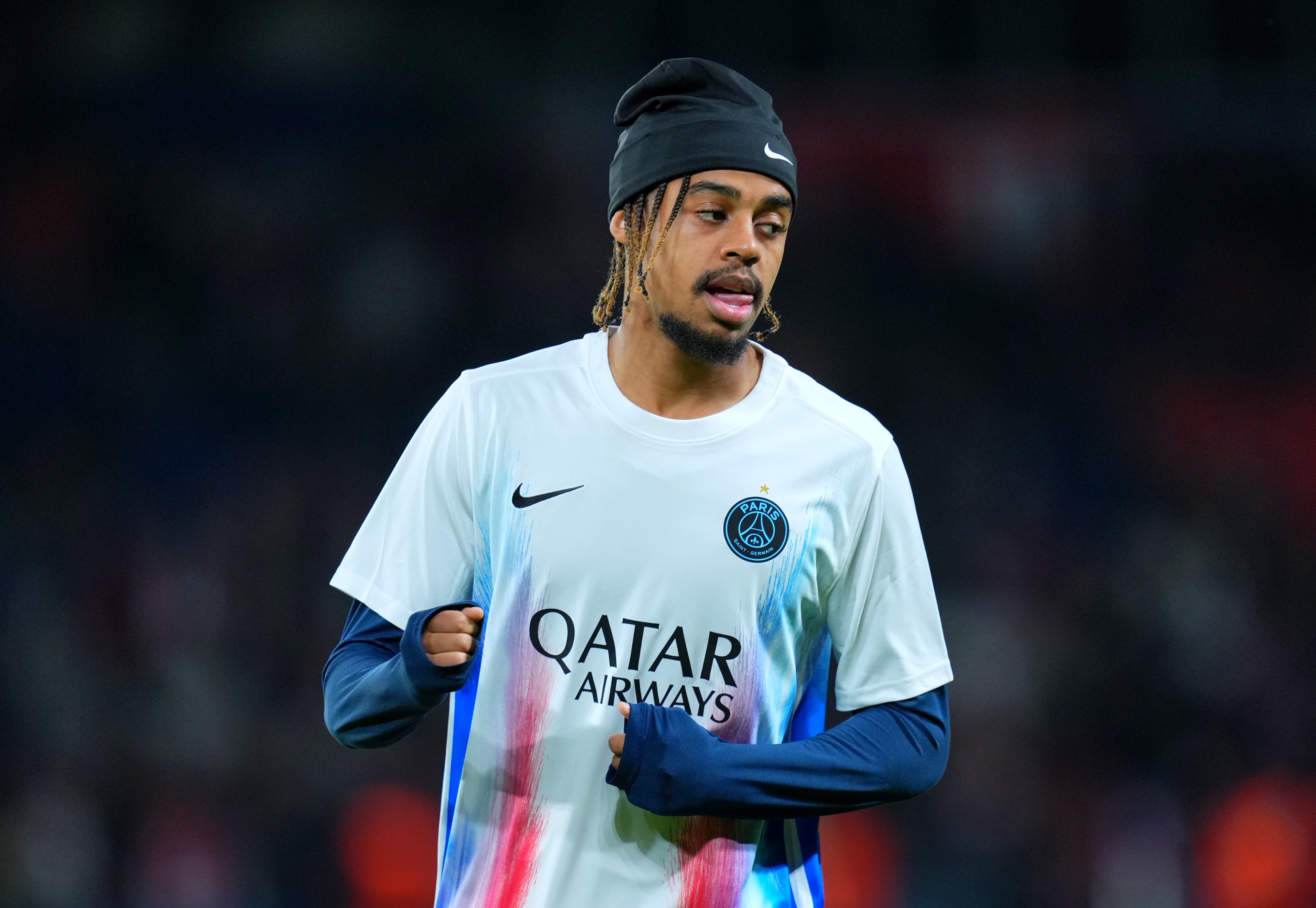 Bradley Barcola warms up ahead of PSG game.