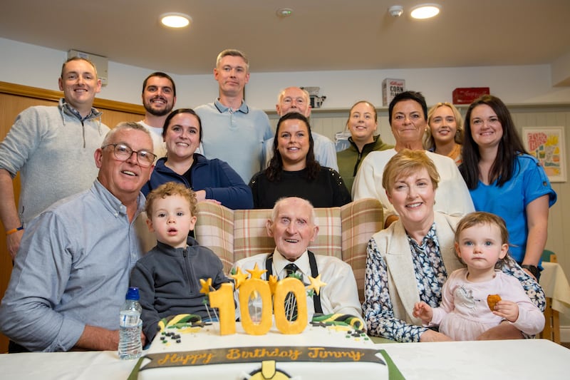 All-Ireland winning Cork hurler Jimmy Lynam celebrating his 100th birthday with his family in Whites Cross, Cork. 
Photograph: Daragh Mc Sweeney/Provision