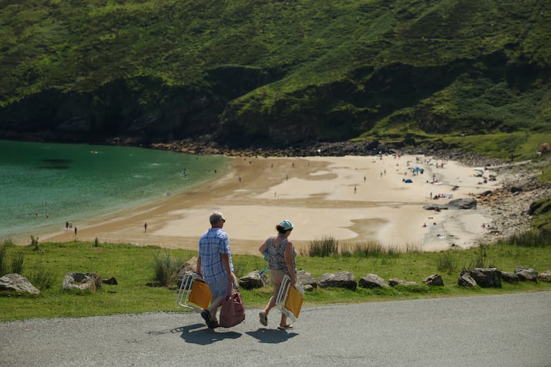 People make their way down to Keem beach in Achill. Photograph: Enda O'Dowd