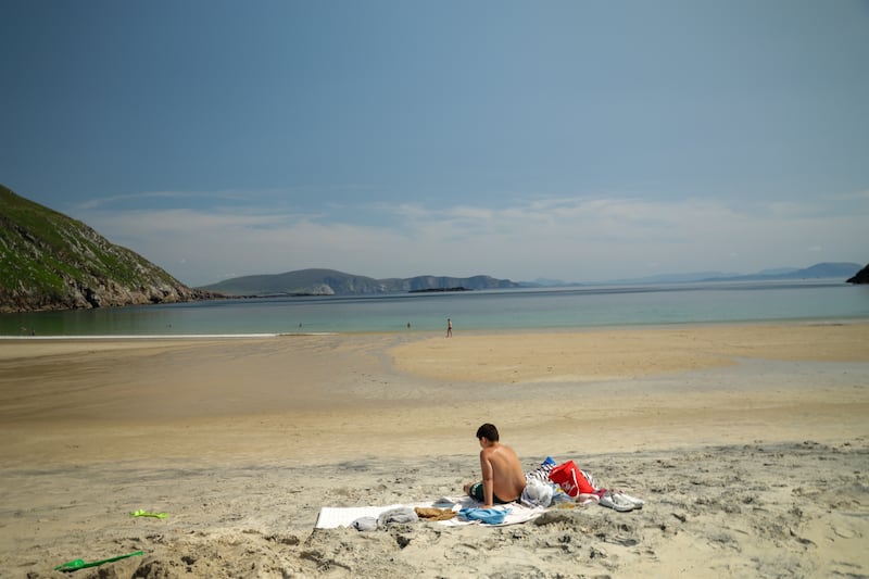 People enjoy the sun on Keem beach in Achill, Co Mayo. Photograph: Enda O'Dowd