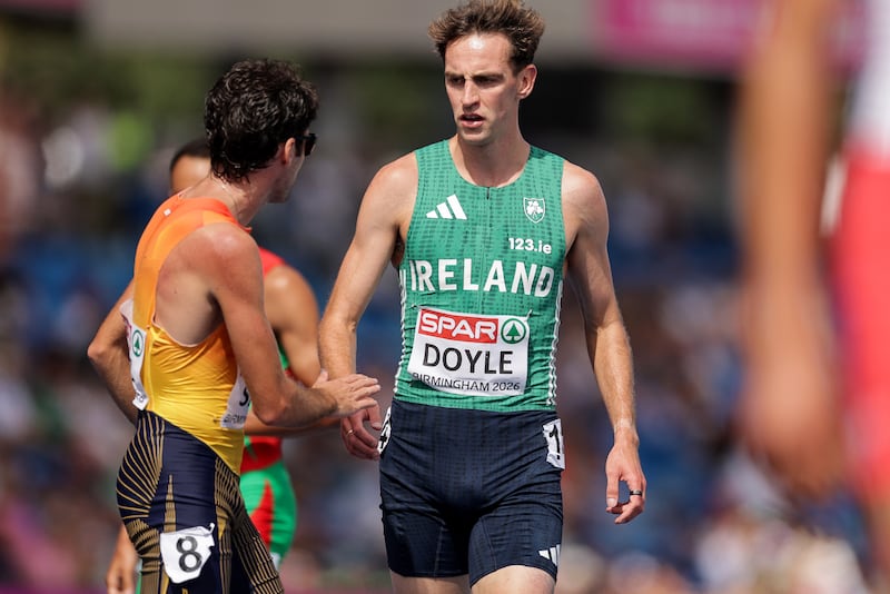 Ireland’s Cathal Doyle with Carlos Saez of Spain after he fell during the 1,500m heats. Photograph: Morgan Treacy/Inpho