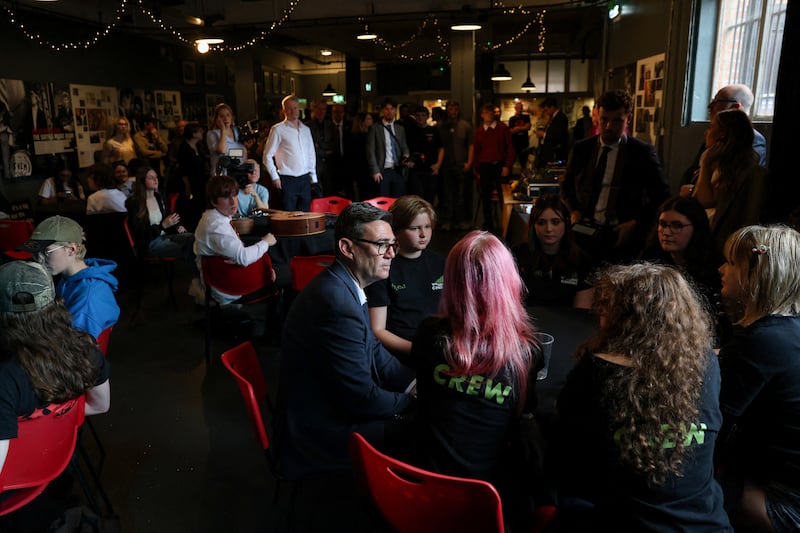 British prime minister Andy Burnham (centre) during a visit to The Oh Yeah Music Centre in Belfast. Photograph: Cathal McNaughton/AFP/Getty