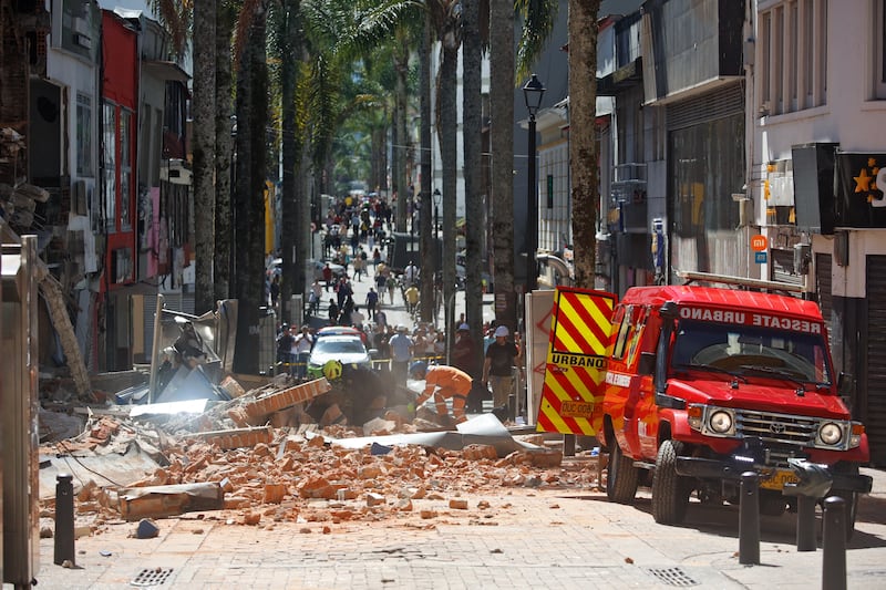 Members of an urban rescue team work after an earthquake in Manizales, Colombia, on Monday. Photograph: John Bonilla/AFP via Getty Images
