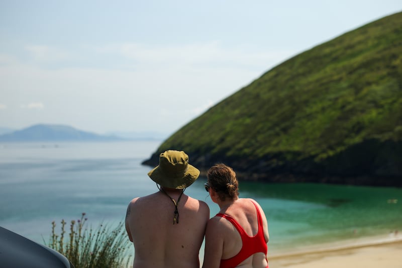 People enjoy the view above Keem Bay, Achill, Co, Mayo. Photograph: Enda O'Dowd