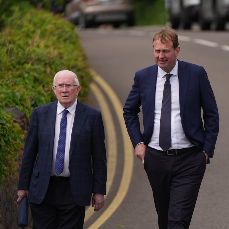 Pat 'the Cope' Gallagher (left) and Minister for Justice Jim O'Callaghan leaving St Cartha's Church in Kilcar after attending the funeral of James and Noreen McHugh. Photograph: Niall Carson/PA Wire