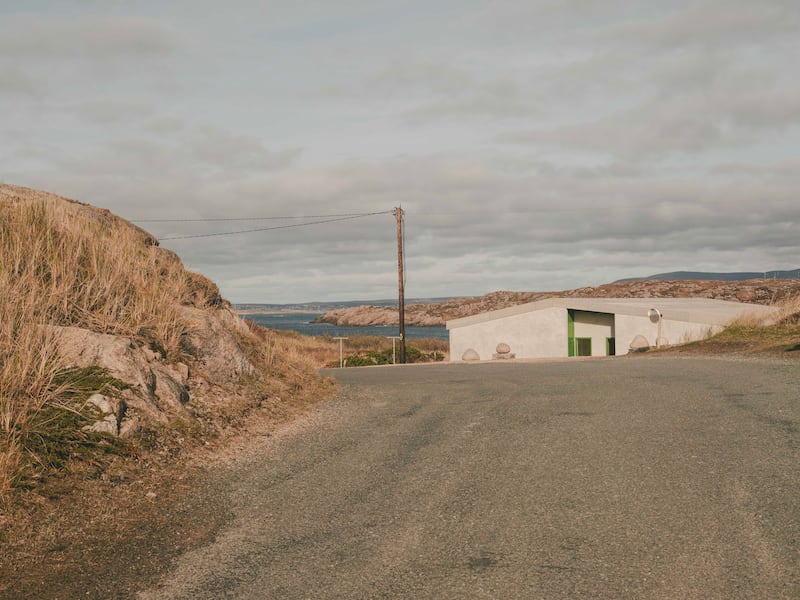 ‘The house sits below a crest on a quiet island
road.’ Photograph: Peter Molloy