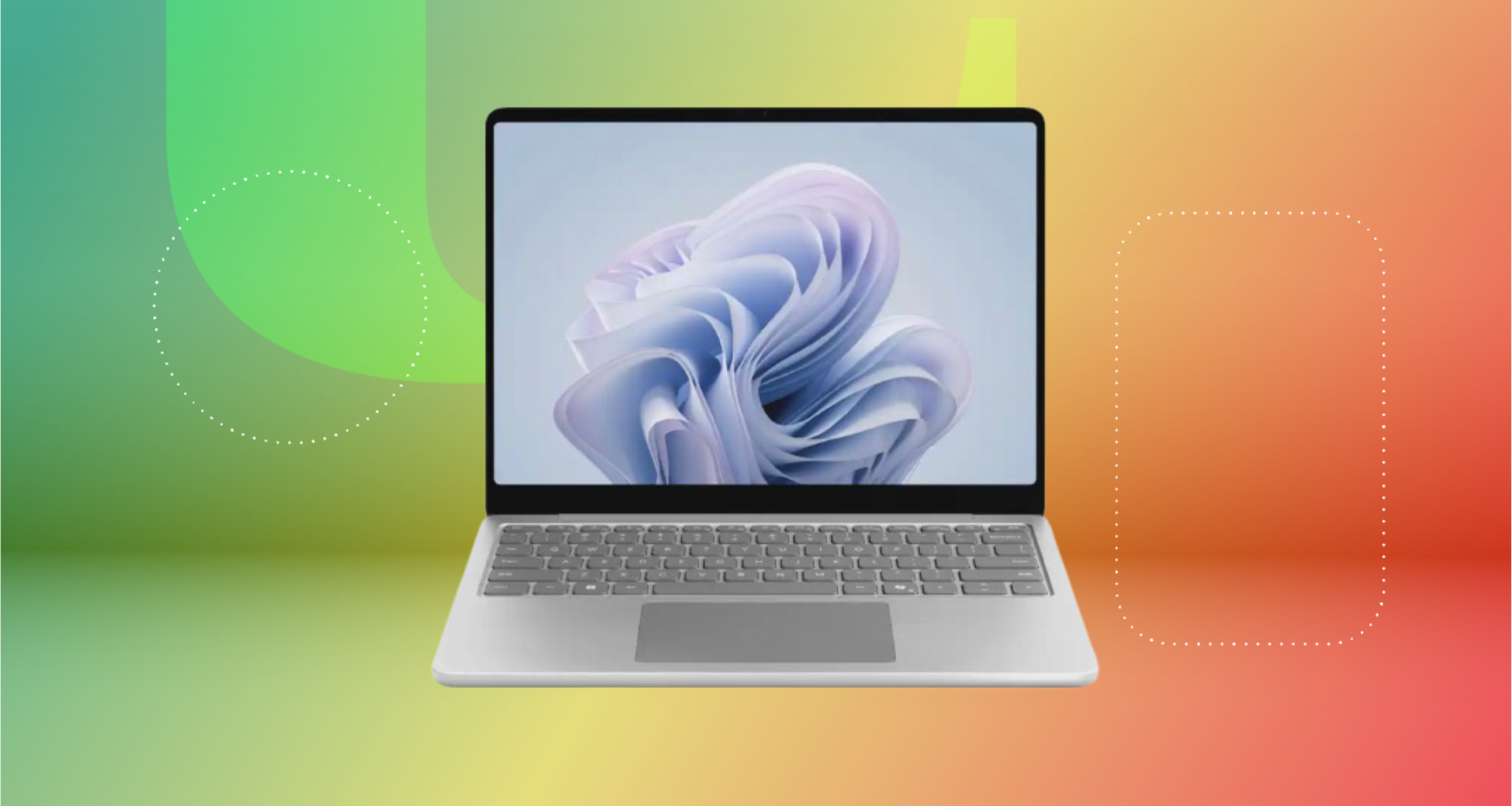 Microsoft surface laptop against green, yellow and red CNET background