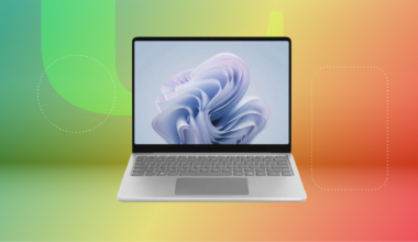 Microsoft surface laptop against green, yellow and red CNET background