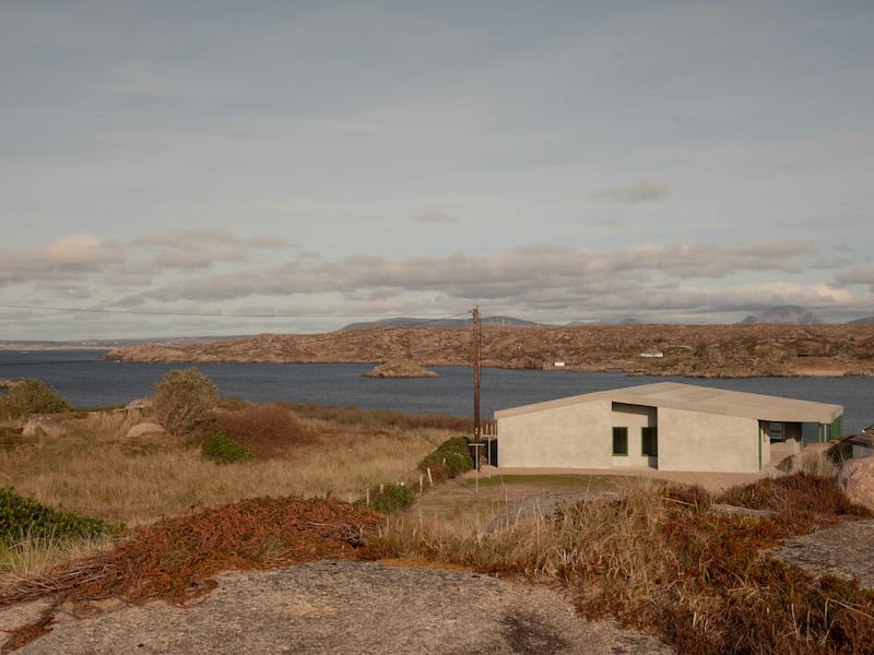 ‘Monotone, muted tones of roughcast rendered walls and a corrugated fibre cement roof.’ Photograph: Peter Molloy
