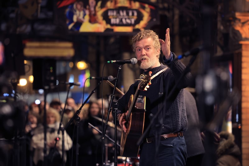 Glen Hansard at the annual Christmas Eve busk for the Dublin Simon Community, outside the Gaiety Theatre in Dublin. Photograph: Dara Mac Dónaill/The Irish Times















