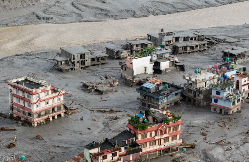 An aerial view shows houses lying deluged in sludge after flash floods at Devighat, Bidur Municipality, in Nepal's Nuwakot district. Photograph: Prabin RANABHAT/AFP via Getty Images