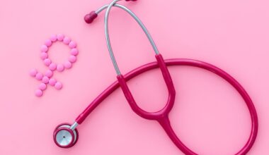 A pink stethoscope and gender icon against a pink background.