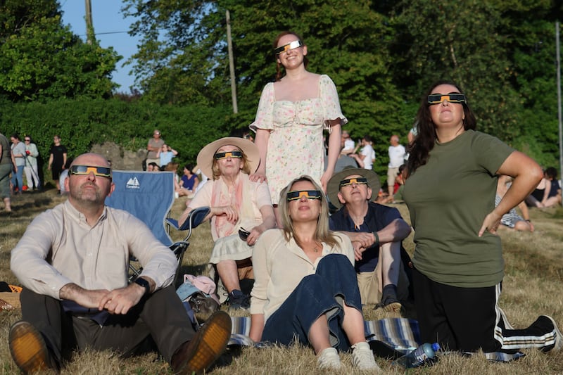 The extended Mernagh family watch the solar eclipse at the Dunsink Observatory in Dublin.