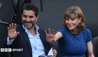 Former Newcastle United shareholders Mehrdad Ghodoussi (L) and Amanda Staveley wave from the directors' box