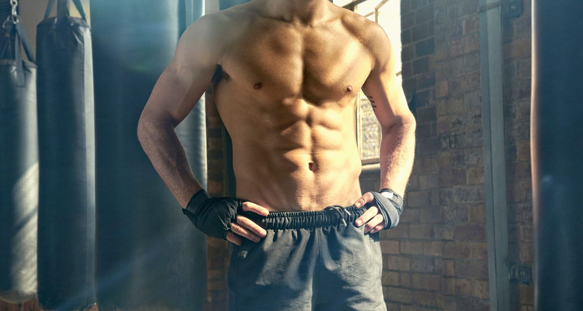 A topless man with a rippling six-pack