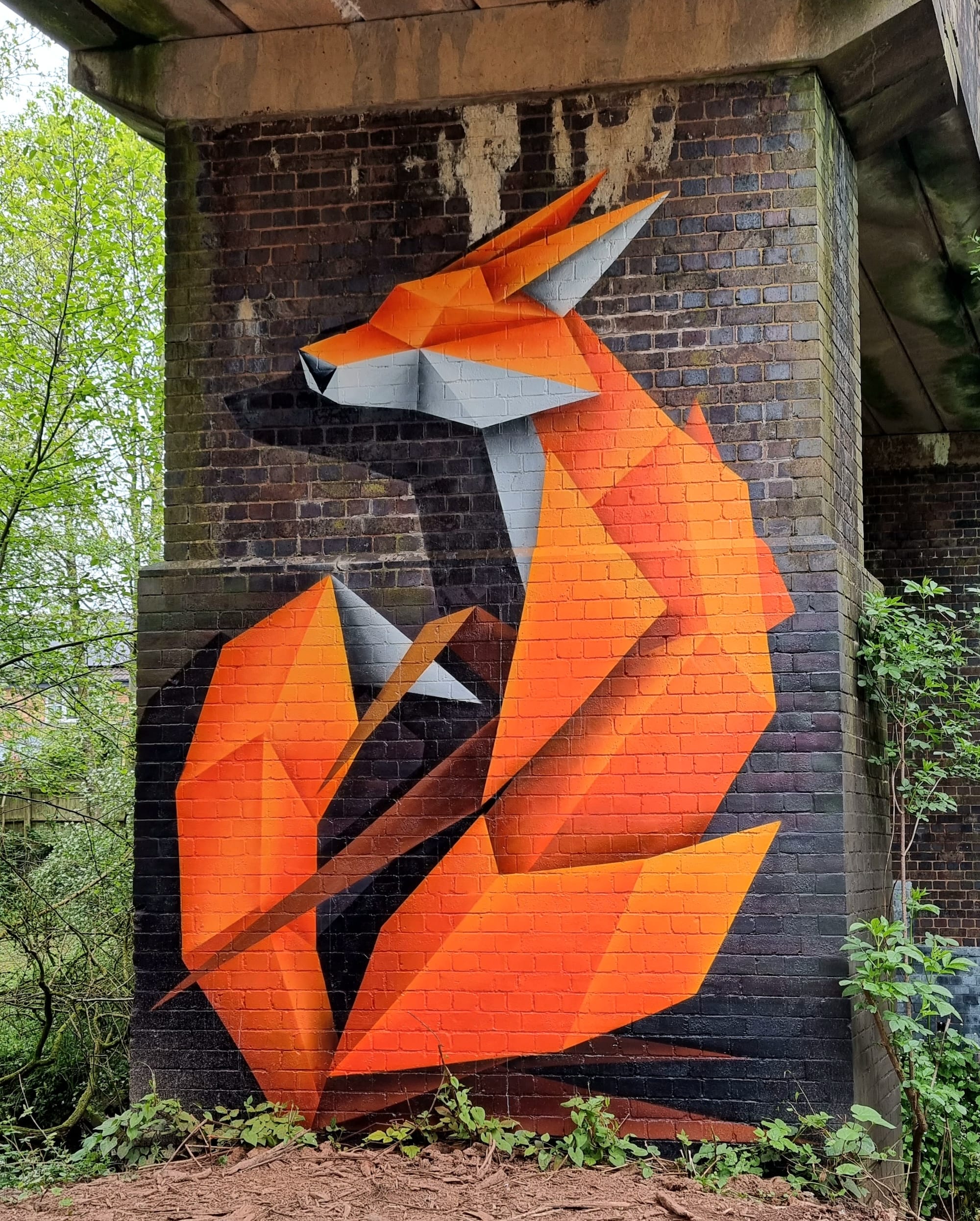a geometric fox mural by Annatomix under a bridge