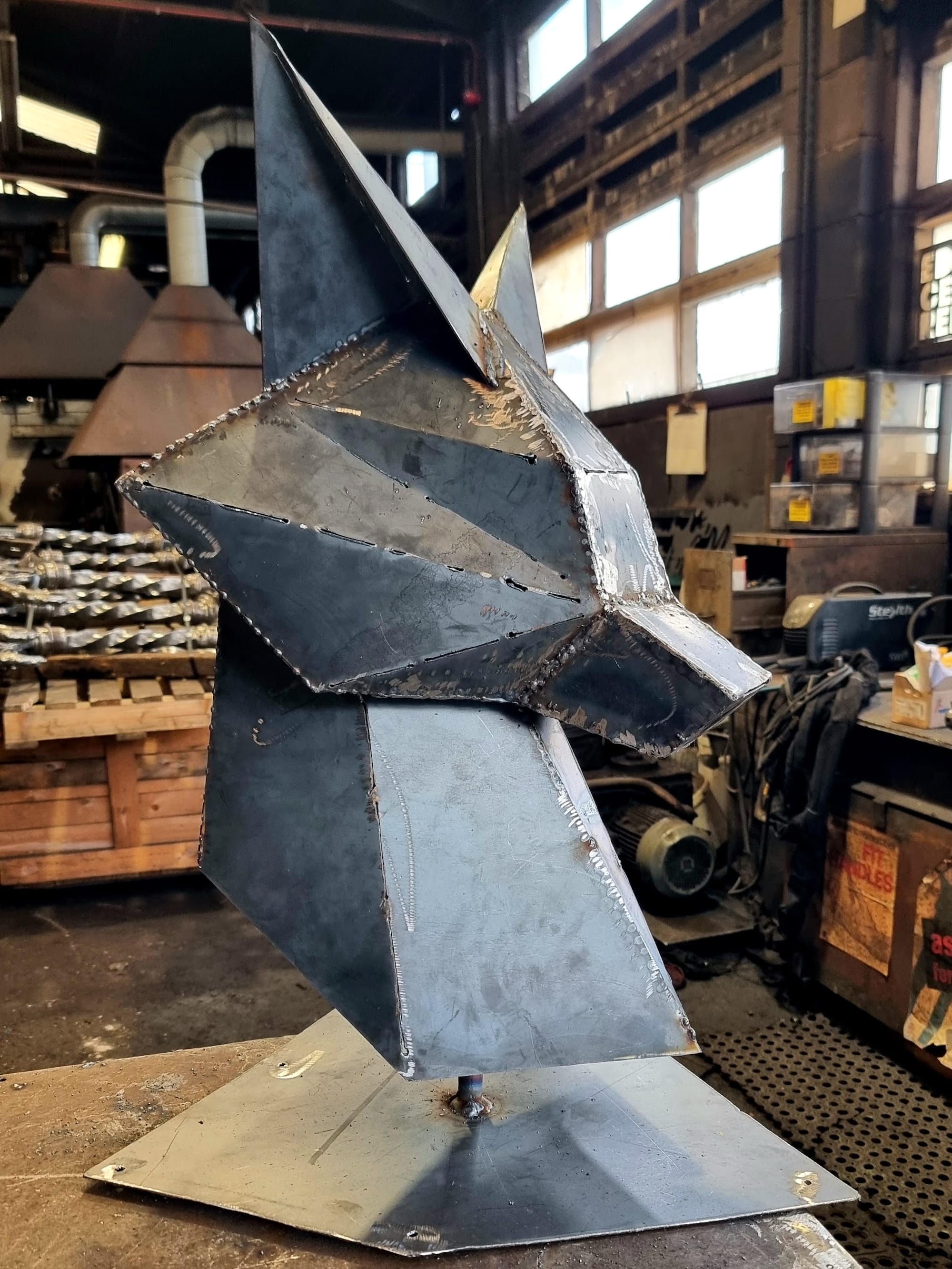 a sculpture in progress by Annatomix of a geometric fox head