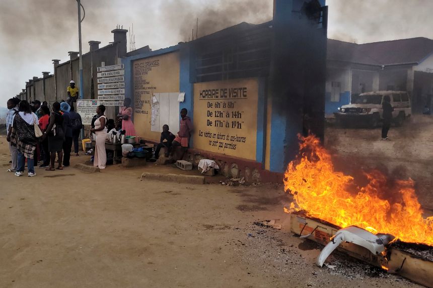 Rubble is set on fire as health workers involved in Congo's Ebola response go on strike as they protest over payment issues in Bunia, on July 15, 2026.