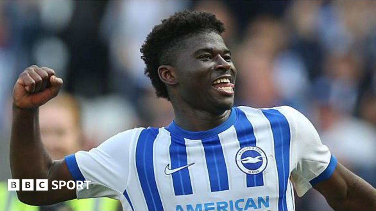Carlos Baleba of Brighton & Hove Albion celebrates in front of the supporters