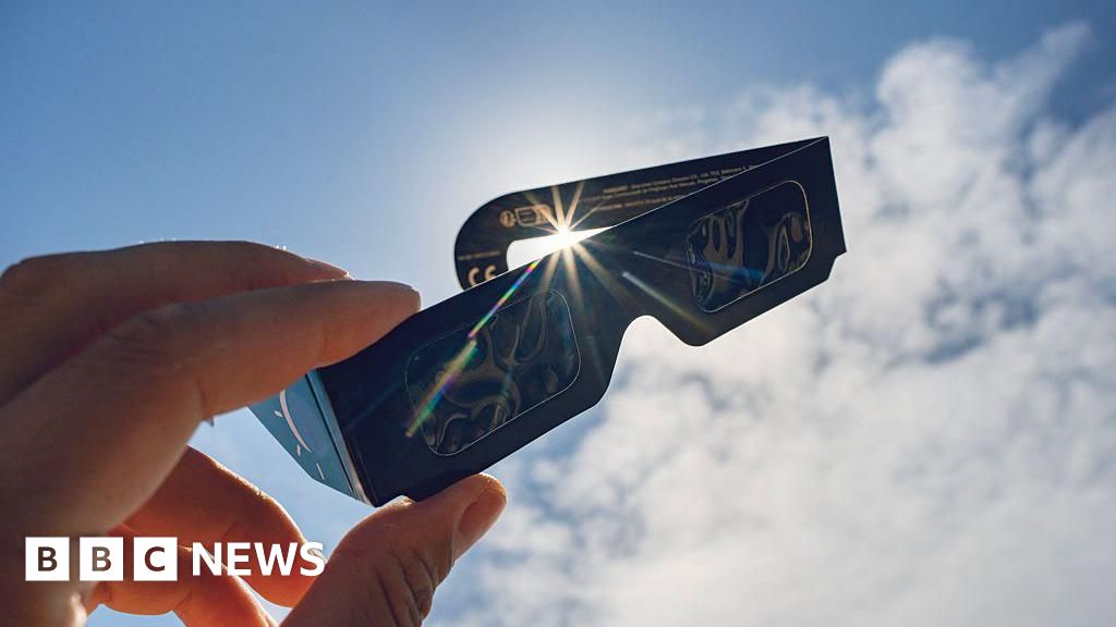 Solar eclipse chasers scramble for glasses as stocks run low - BBC