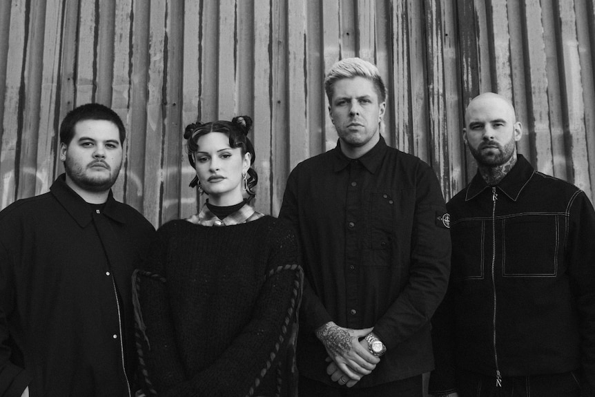 Black & white image of three male members and female vocalist of Canadian band Spiritbox