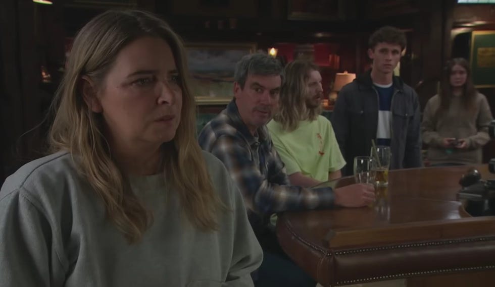 emmerdale group of people in a pub watching something intently