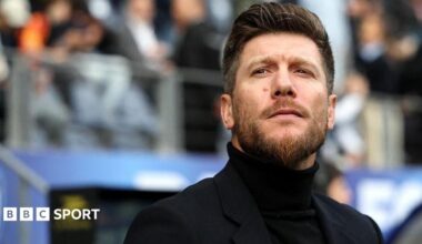 Head and shoulders view of a bearded Sebastien Pocognoli in black rollneck jumper and dark smart jacket
