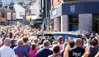 Crowd bursts into rendition of Bonnie Tyler hit as coffin returns home