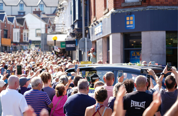 Crowd bursts into rendition of Bonnie Tyler hit as coffin returns home