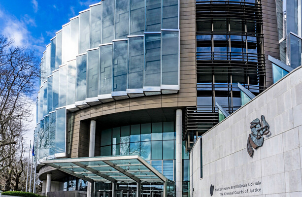 Garda appears before court charged with seeking to hire hitman to murder a woman and three children
