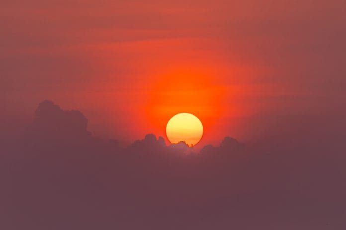 Dramatic sunset sky view with clouds and sunbeam. Hoi An - Vietnam.