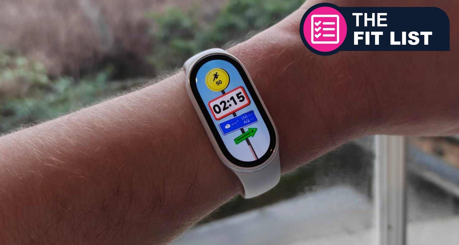 Caucasian man wearing xiaomi fitness tracker with TR Fit List badge