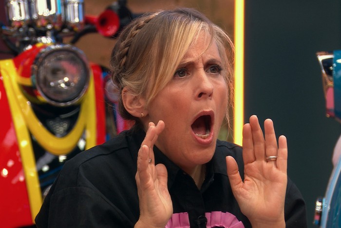 Mel Giedroyc on Last One Laughing UK with a shocked expression on her faced and holding her hands up.
