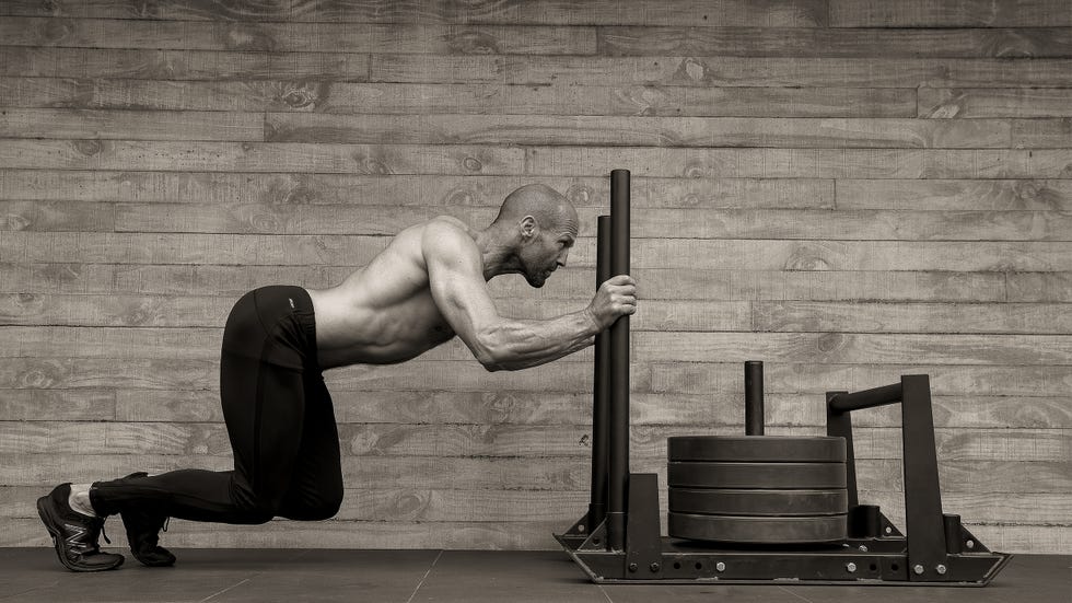 jason statham pushing heavy sled