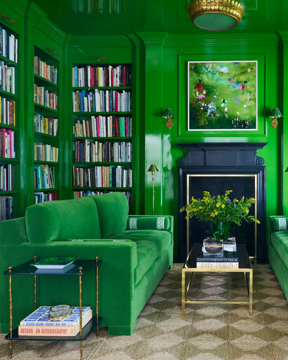 library room with green walls and green sofas
