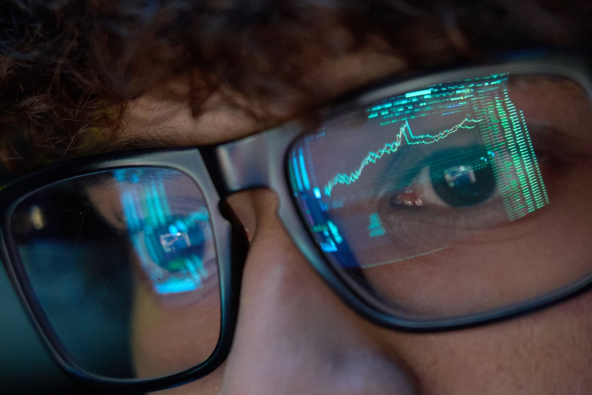 Investor watching a stock chart rise.