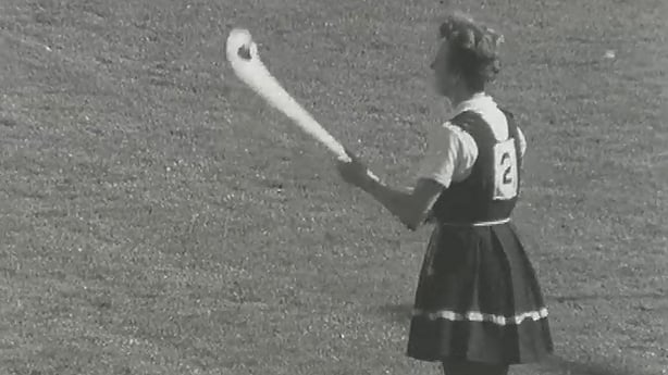 A gymslip wearing camogie player