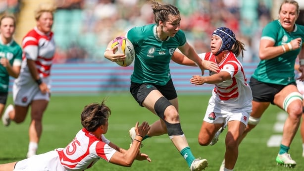 24 August 2025; Eve Higgins of Ireland is tackled by Japan players Sora Nishimura, left, and Moe Tsukui during the Women's Rugby World Cup 2025 Pool C match between Ireland and Japan at Franklin's Gardens in Northampton, England. Photo by Harry Murphy/Sportsfile