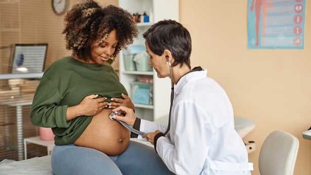 Pregnant woman with doctor