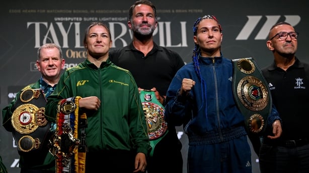 1 September 2026; Katie Taylor and Flora Pili, right, square-off in the company of Brian Peters, Katie Taylor's manager, left, and Matchroom Boxing promoter Eddie Hearn, centre, during a press conference, held at The Helix in DCU, Dublin, ahead of their undisputed super lightweight championship figh