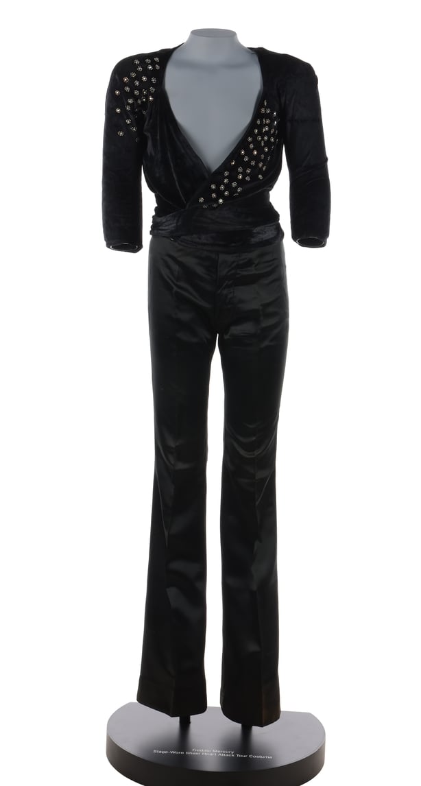 black wrap-around embellished top and flared trousers