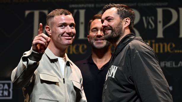Fighters Paddy Donovan, left, and Tyrone McKenna face-off, under the watch of Matchroom promoter Eddie Hearn, during a Matchroom Sport media conference at Vicar Street in Dublin.