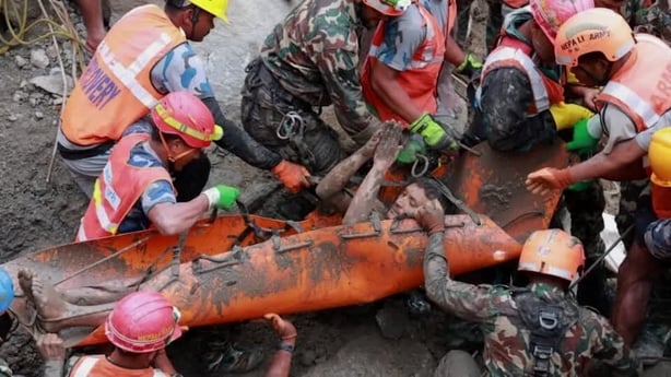 A hydropower worker is rescued from a tunnel in Nepal